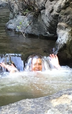 Woman in river having a hydro massage