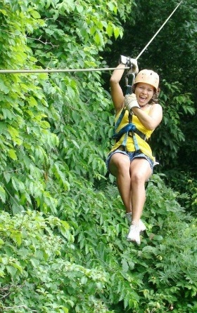 happy woman on zipline